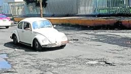 Parchan baches a medias en Iztapalapa