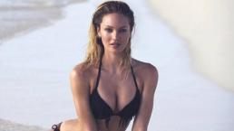 Candice Swanepoel enseña intimidad con playera mojada